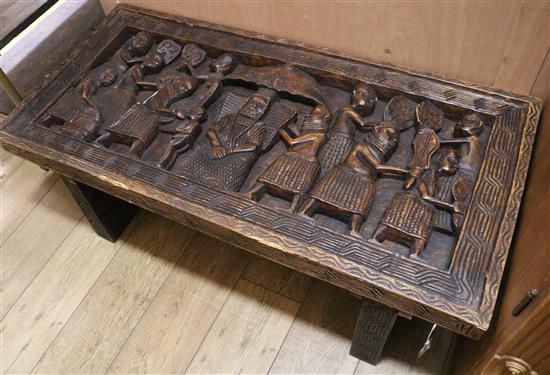 A heavy carved coffee table W.122cm